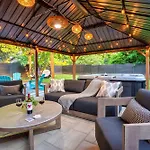 Uptown Oasis, Hot Tub, Swing Chairs, Fire Pit, Gazebo