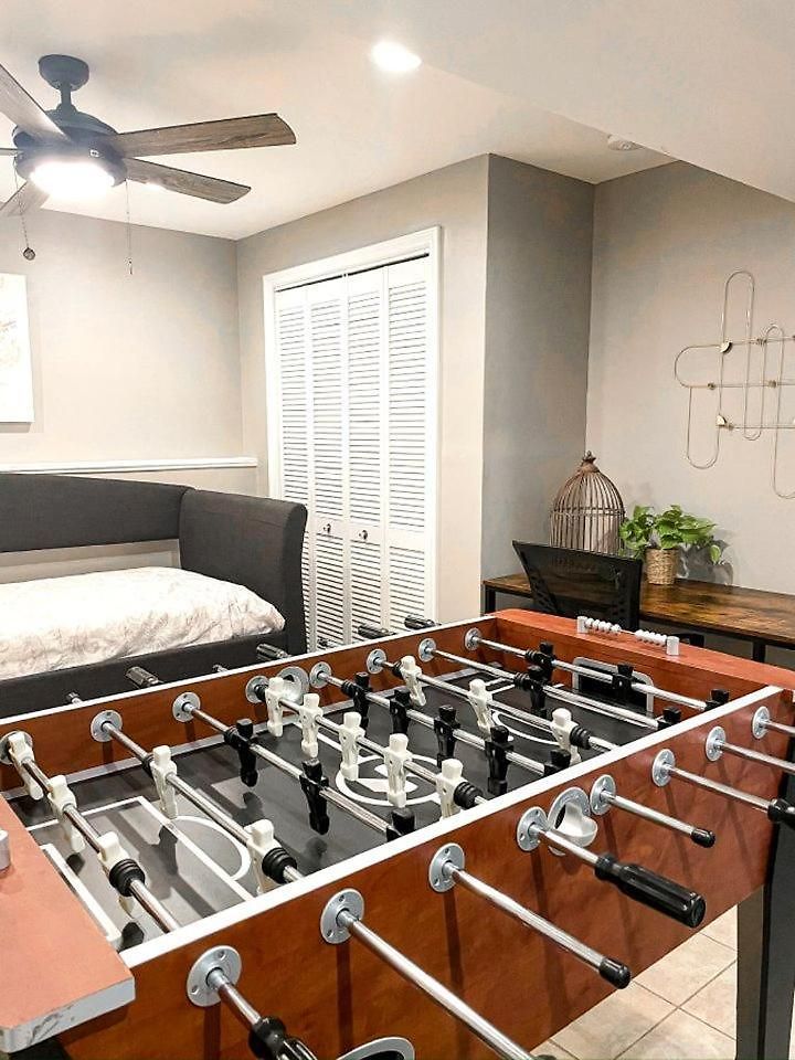 Family With Outdoor Living Areas And Foosball Table In Nc