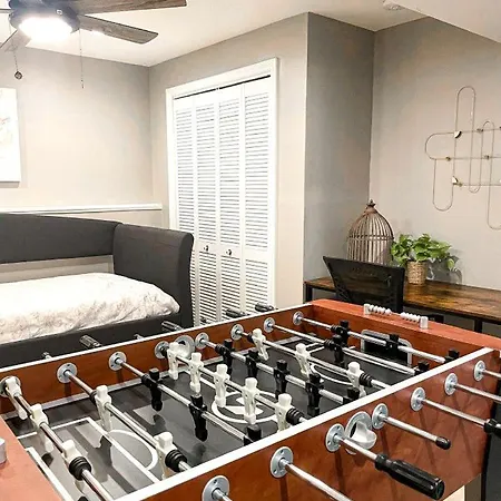 Family With Outdoor Living Areas And Foosball Table In Nc