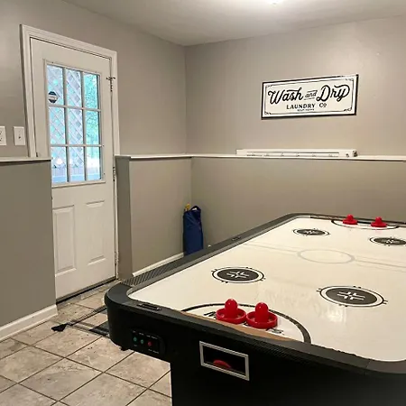 Family With Outdoor Living Areas And Foosball Table In Nc