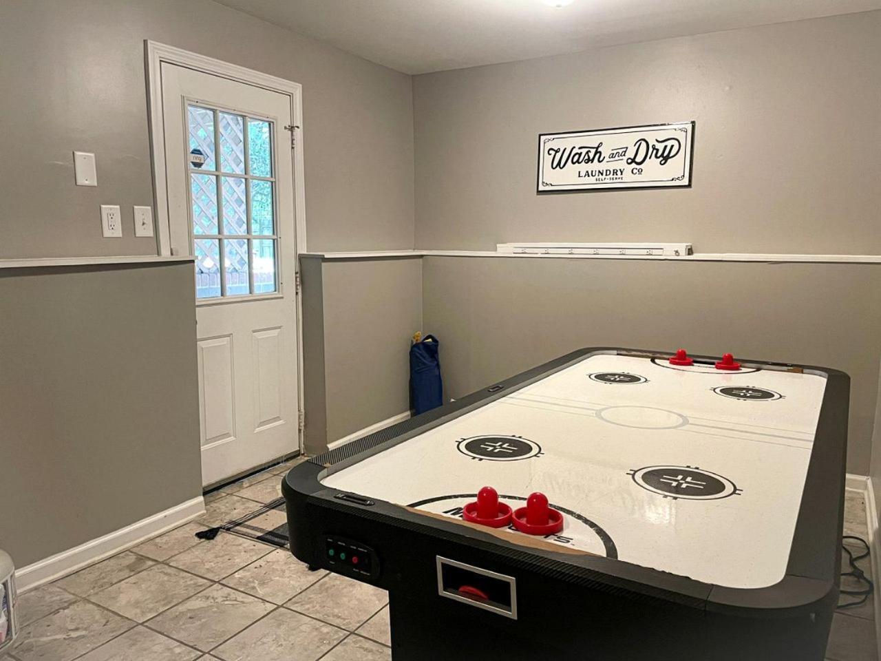 Family With Outdoor Living Areas And Foosball Table In Nc